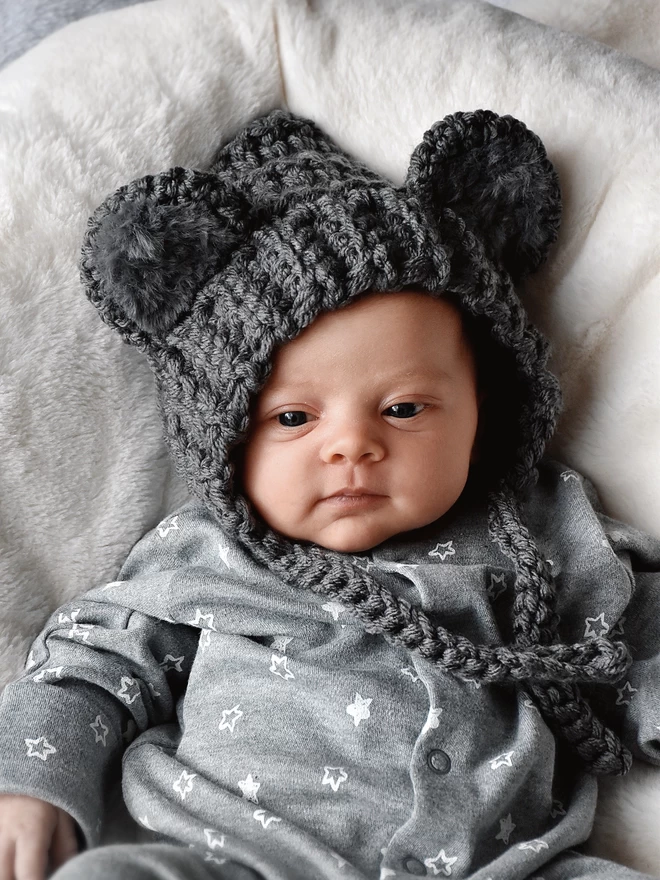 Newborn baby in handmade Koala hat
