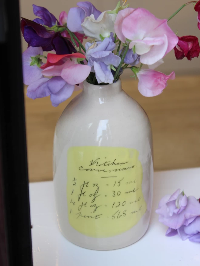 ceramic bottle vase with sweet peas