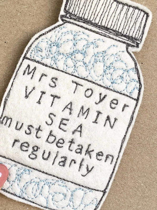 Vitamin Sea Personalised Medicine Bottle presented on a brown card
