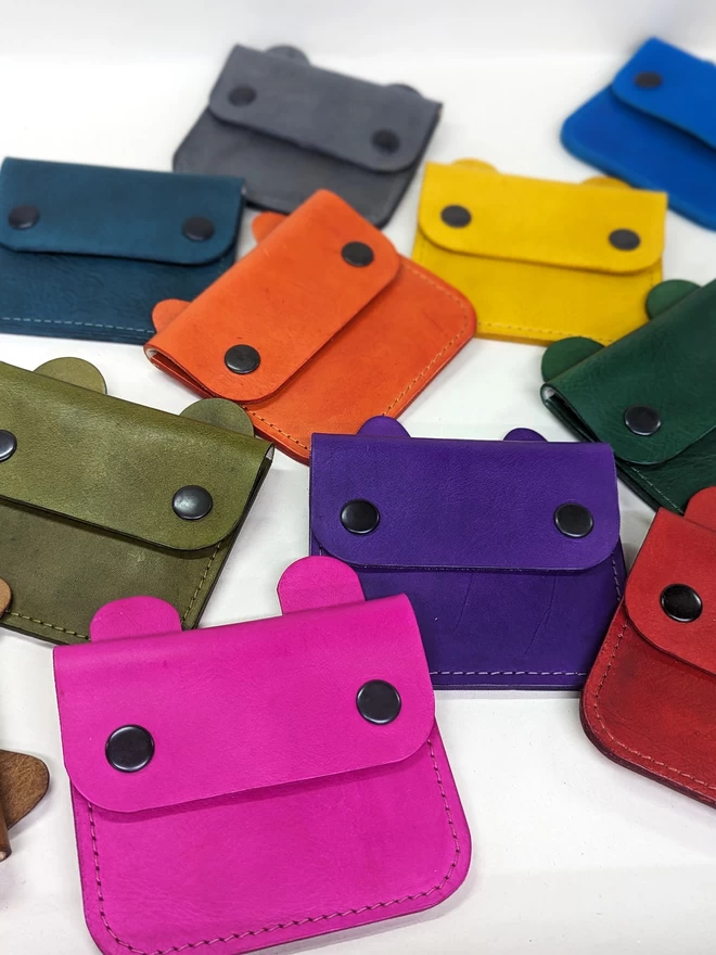 Image of assorted Notch Handmade 'Tiny Wild' animal purses in various colours.