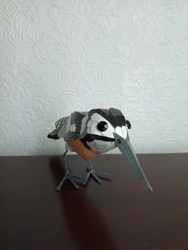 paper sculpture of a great spotted woodpecker
