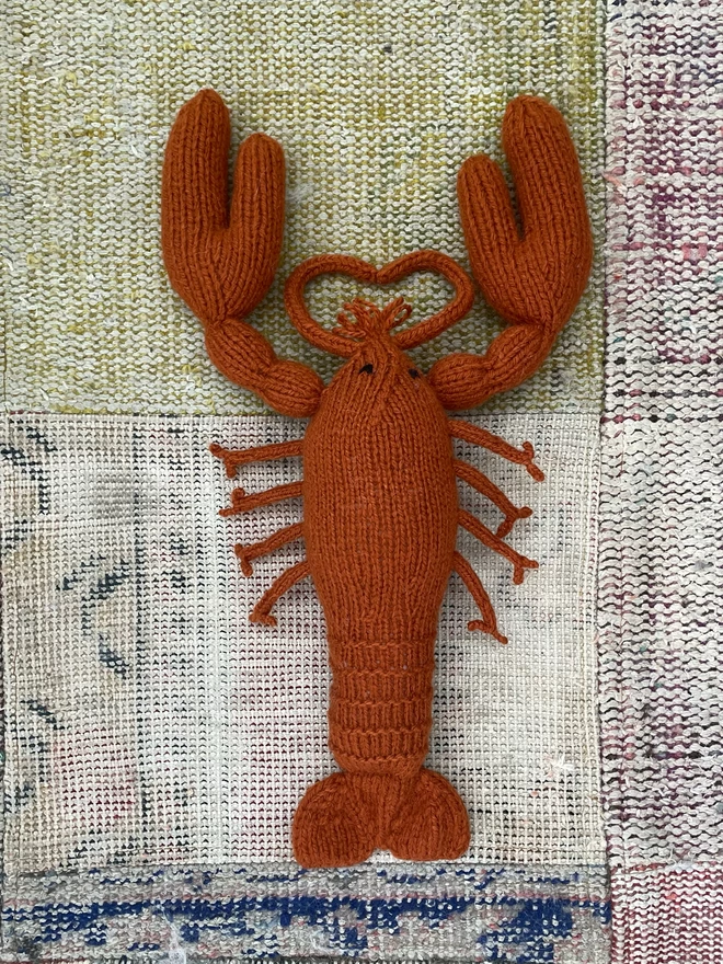 Knitted toy lobster in red