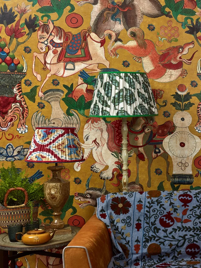 Pair of Silk Ikat Lampshades in a Yellow-Styled Patterned Wallpapered Room