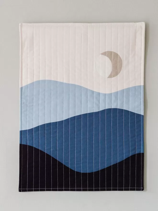 Crescent Quilt Hanging On Wall