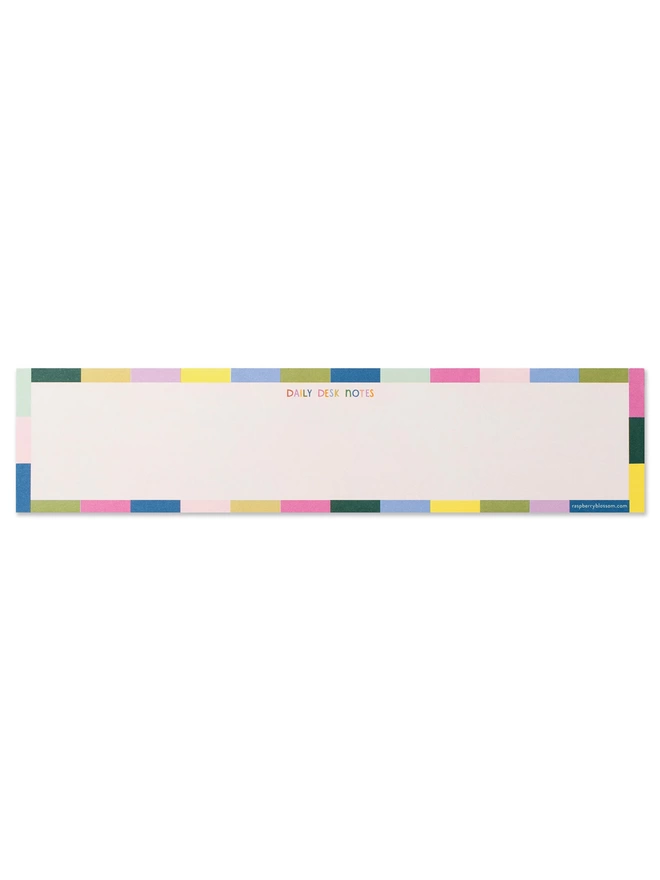 Keyboard notepad with ‘Daily desk notes’ in colourful hand lettering, with a rainbow tile design border 