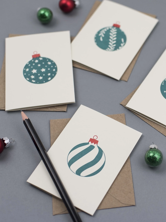 Four green Christmas baubles letterpress designs on small cards