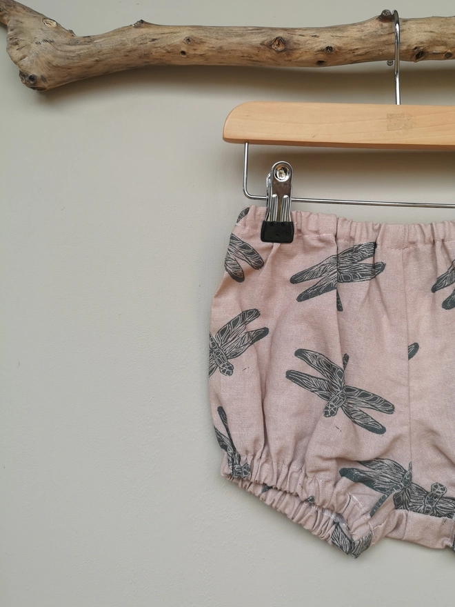 Pink Cotton Linen Baby Bloomers. Elasticated waist and leg holes. Featuring a delicate charcoal grey dragonfly print.