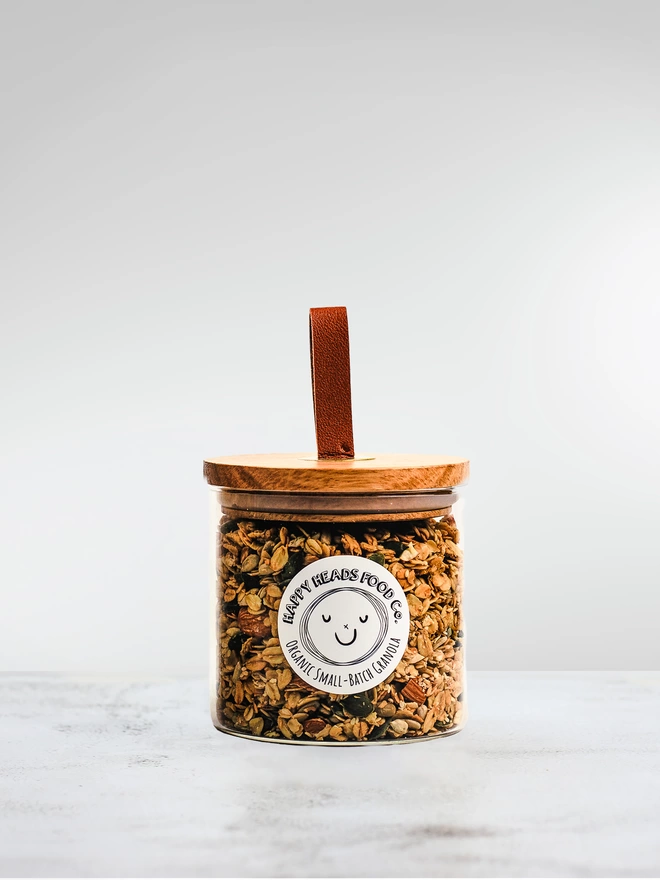 Happy Heads 'Original' granola in a small (250 g) glass jar