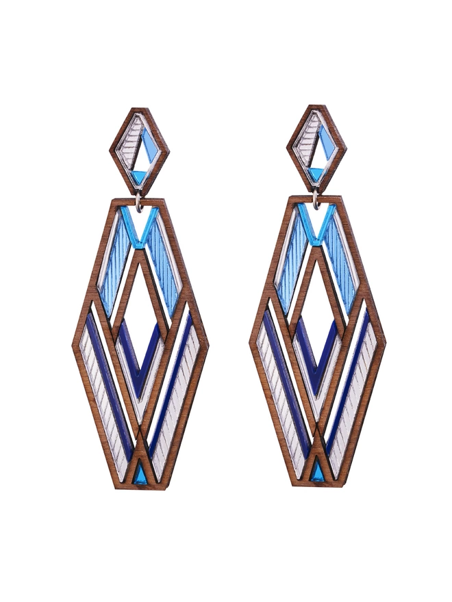 Slim Hexagon shaped Earrings in blue tones and walnut wood around the edges. Small hexagon stud with a bigger hexagon shape drop. The earrings have intricate pattern for the blue and silver tones.
