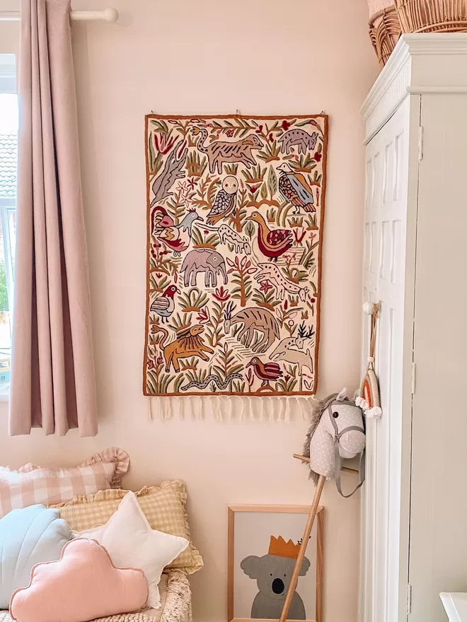 Moppet hand-embroidered tapestry in bedroom