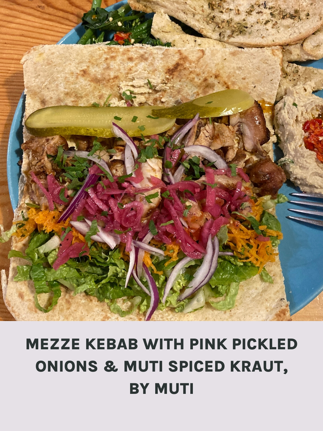 A Mezze Kebab With Pink Pickled Onions And Muti Spiced Kraut.