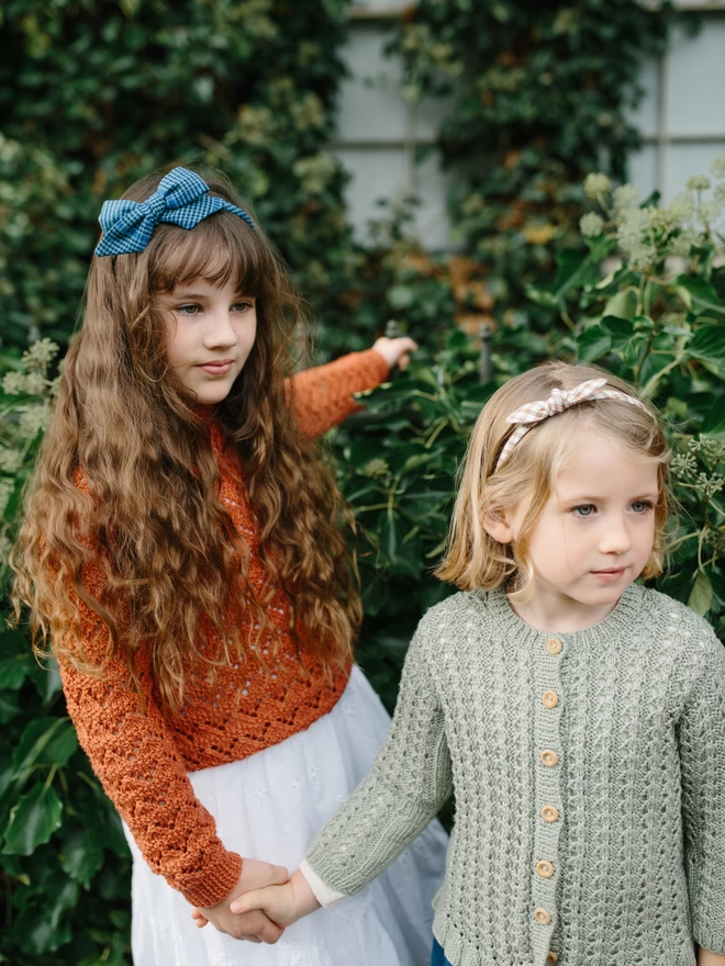two girls outside in the gingham Hairbands