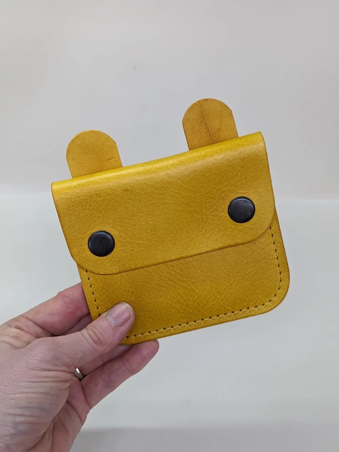 Front view of leather 'Tiny Wild'  Bunny  purse in yellow.