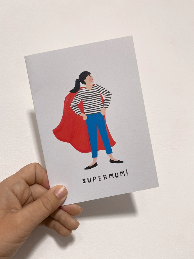 supermum card in hand