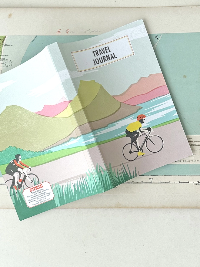 Open cycling journal showing full cover