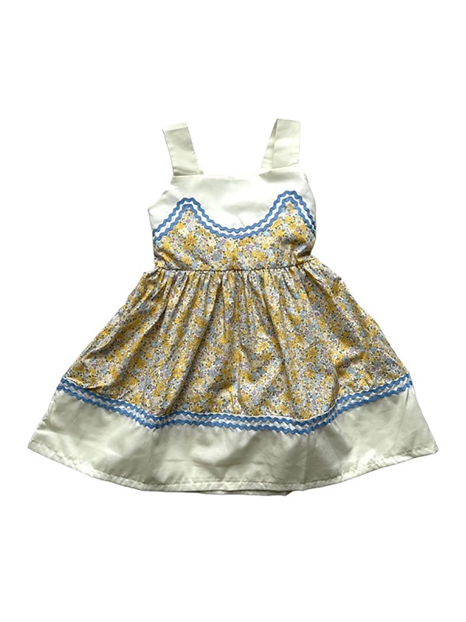 Yellow floral sundress with upper, straps and hem in pale lemon and blue rikrak detail.