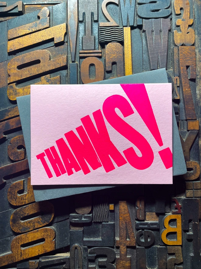 Thanks! A vibrant thank you typographic letterpress candy pink card with deep impression print using fluorescent pink, with a range of colourful envelopes. Slight print variations adding to the style anding to the charm of this handmade greeting card.