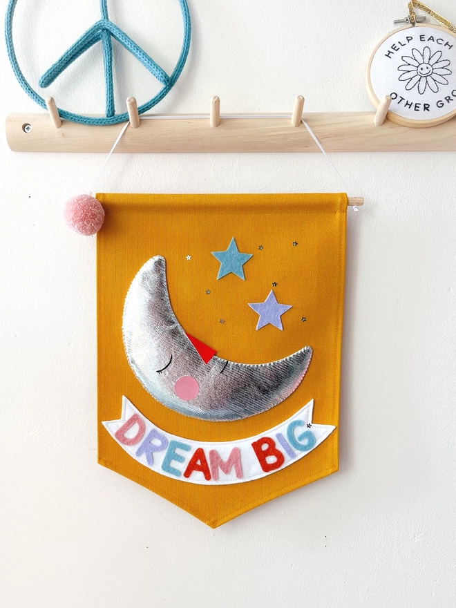 Dream big banner with a silver moon 