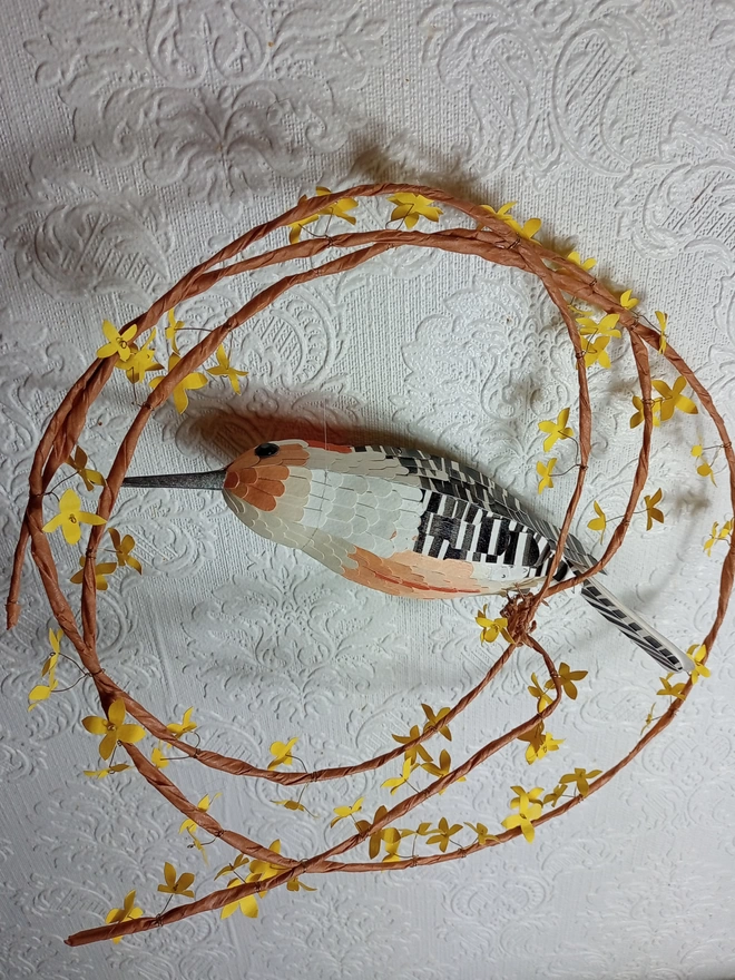 back view of a woodpecker wall hanging