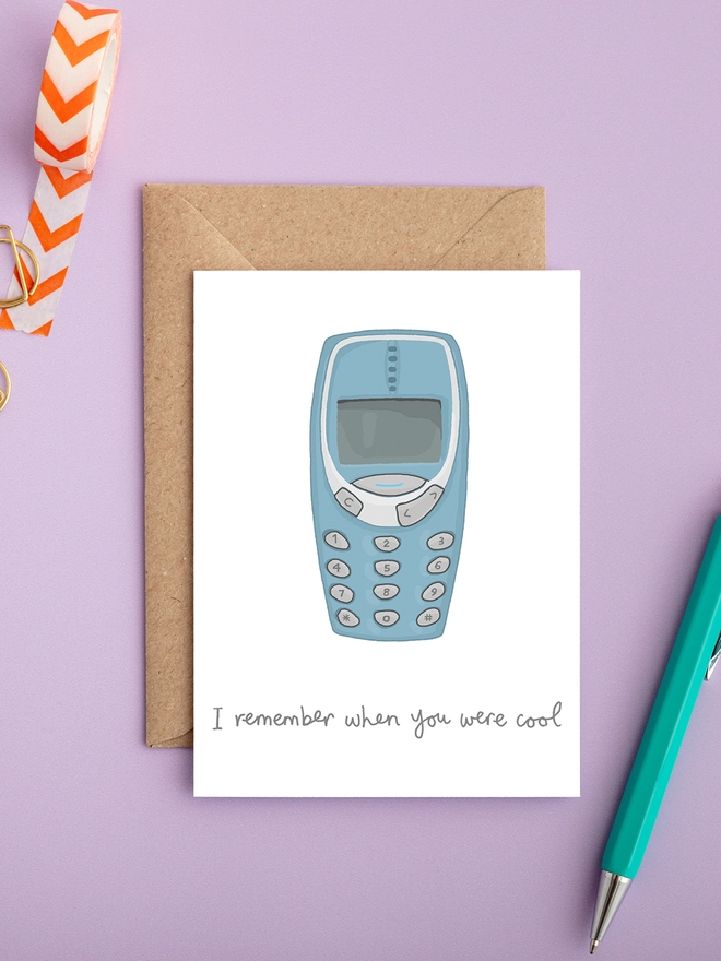 Humorous and funny gender neutral retro birthday card featuring old Nokia 3310 mobile phone