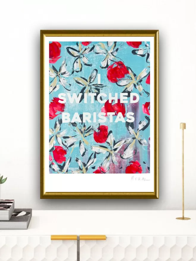 I SWITCHED BARISTAS fine art print.  Based on an original monoprint by M.E. Ster-Molnar.  Shown against an off white wall with a brass candlestick.  