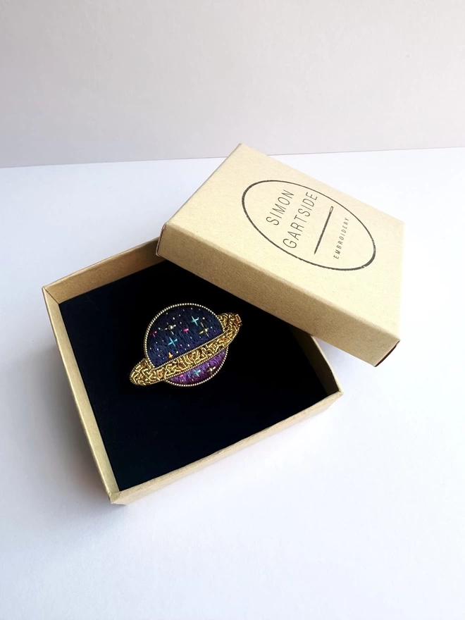Planet brooch in box