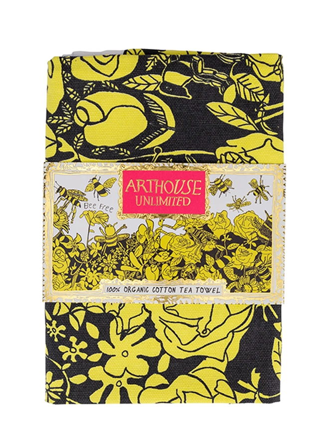 Close up of bee free 100% organic cotton yellow & black charity tea towel with arthouse unlimited logo