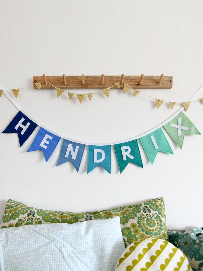 Blue and green name bunting.