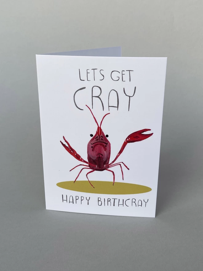 Illustrated birthday card with a cray fish that reads - Lets get Cray, Happy Birthday