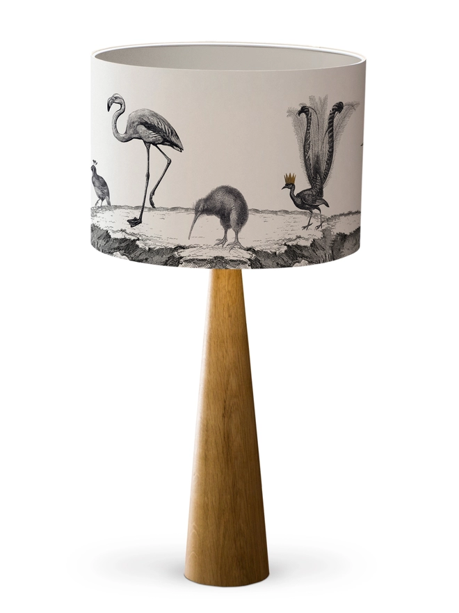 Drum Lampshade featuring birds with a white inner on a wooden base on a white background