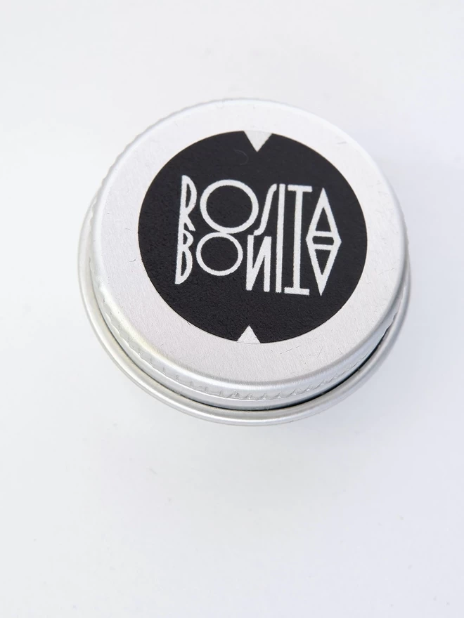 small silver tin with Rosita Bonita Logo in Black