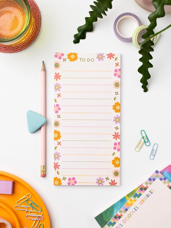 Colourful Raspberry Blossom list pad with rainbow lines and a retro floral border