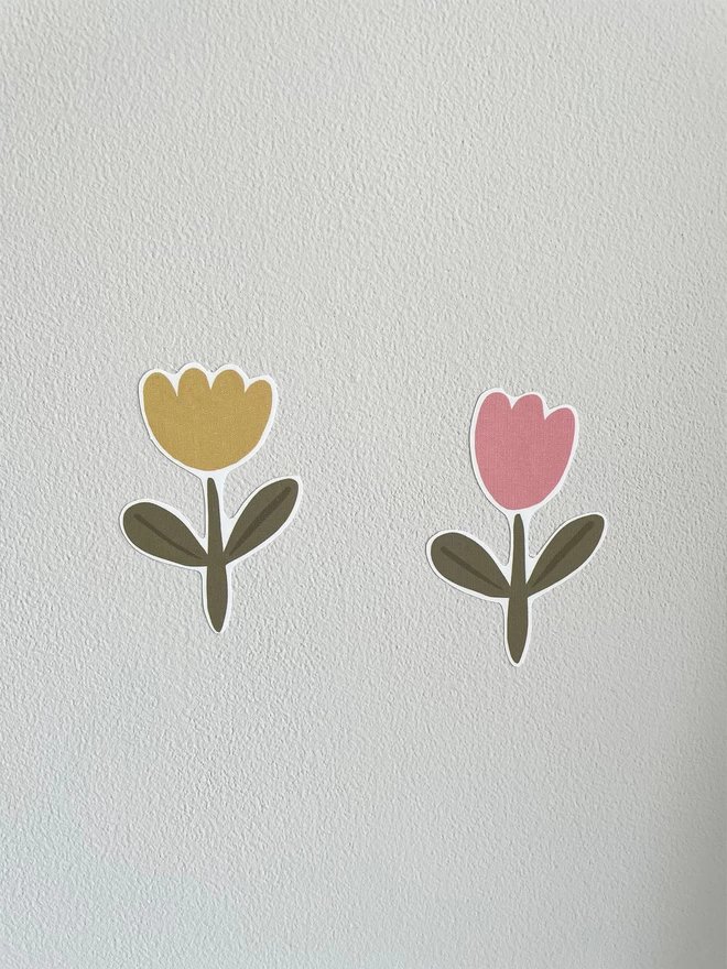 Kids Pink and Yellow Tulip Flower Wall Stickers shown on off white wall