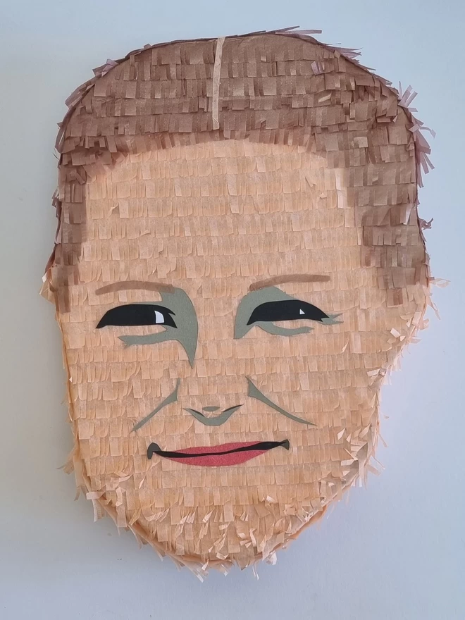 a portrait pinata of a ladies face looking whistfully into the distance