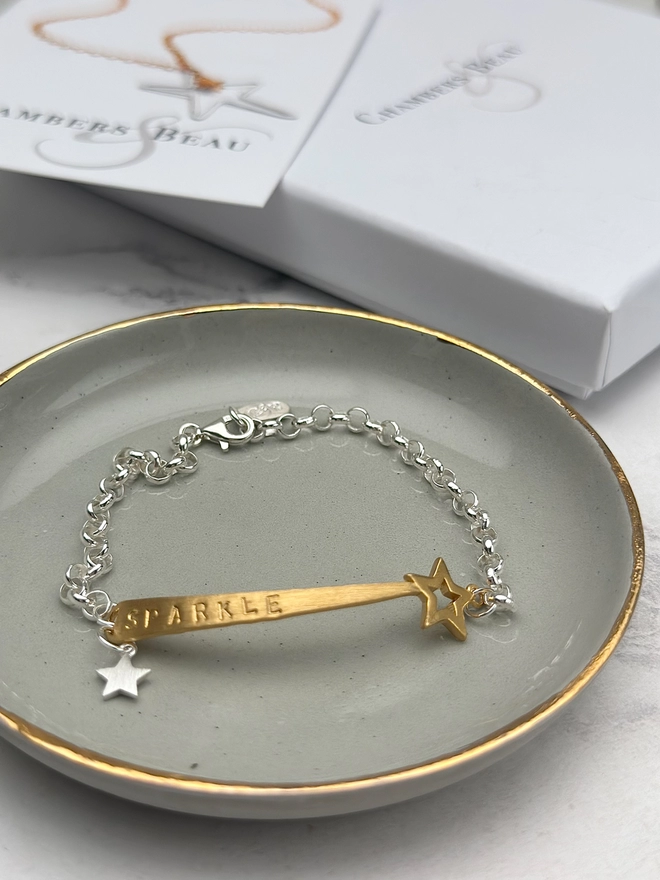 personalised shooting star charm bracelet in gold on silver belcher chain with additional silver star charm. gift box and pouch