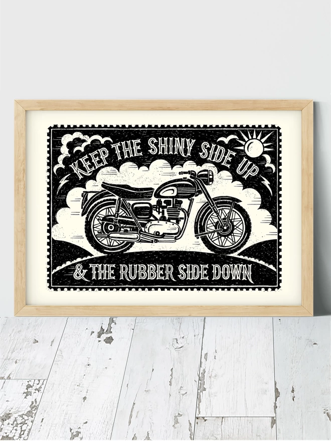 black and white motorbike print in a wooden frame