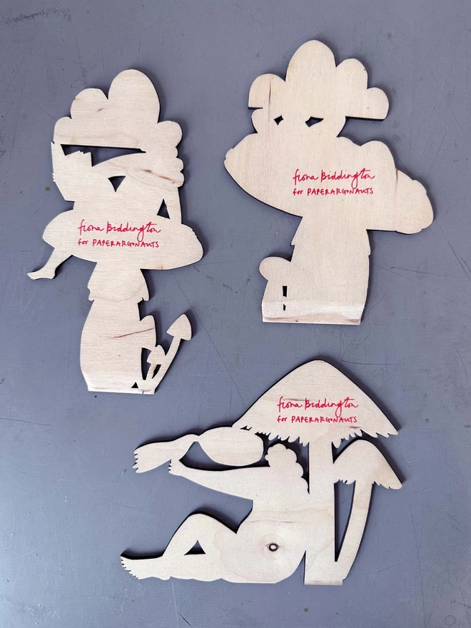 The back of the toadstool guardians, showing the birch plywood and signature