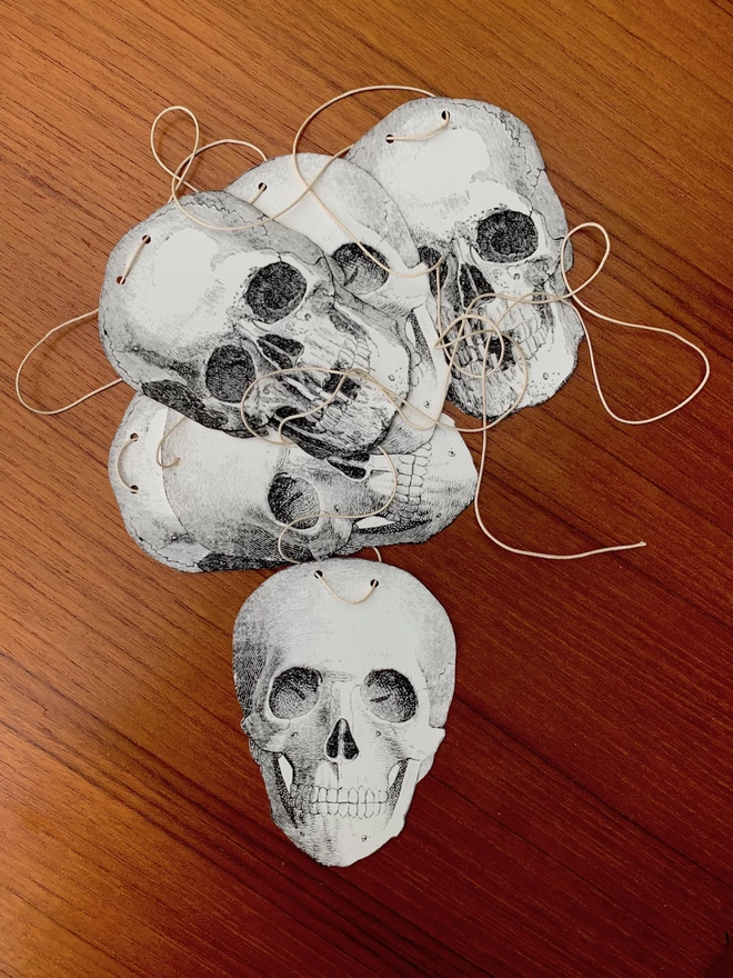 Skull bunting piled on a mid century table