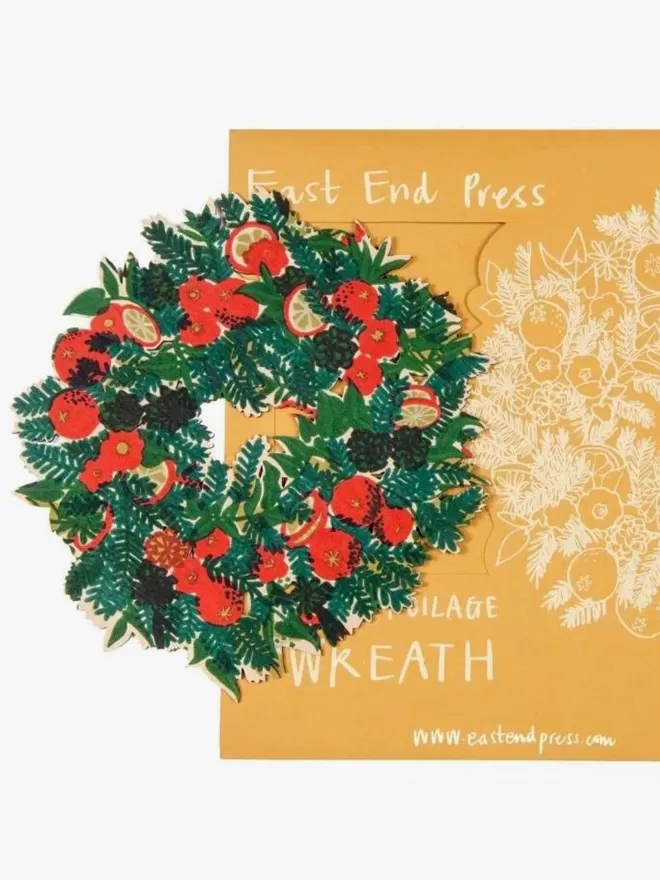 The Wooden Foliage Wreath seen on top of the packaging