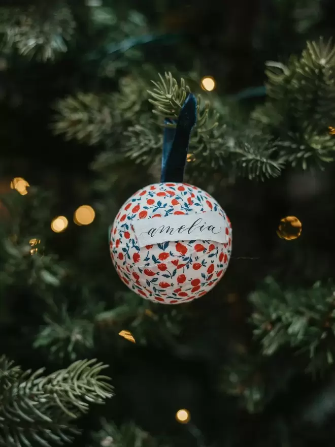 personalised bauble with name on a tree