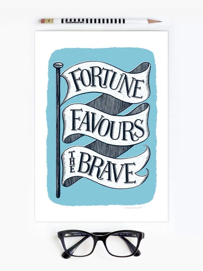fortune favours the brave flag encouragement print unframed on a white background with pencil and black glasses