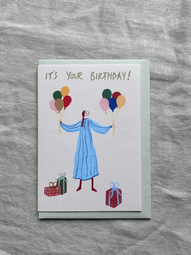 birthday card with girl and balloons and presents on