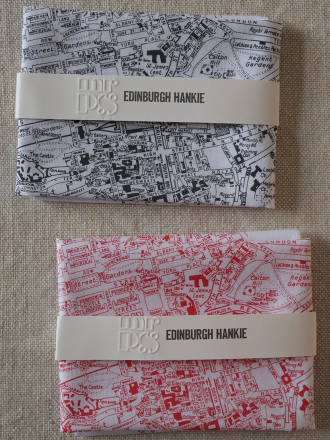 Two folded Mr.PS Edinburgh map hankies to show the colour options available: charcoal grey and red