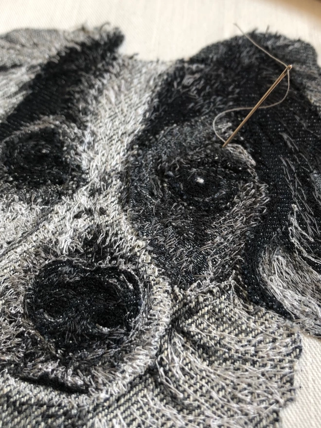 close -up detail of the making of an embroidered pet portrait
