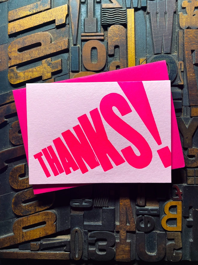 Thanks! A vibrant thank you typographic letterpress candy pink card with deep impression print using fluorescent pink, with a range of colourful envelopes. Slight print variations adding to the style anding to the charm of this handmade greeting card.