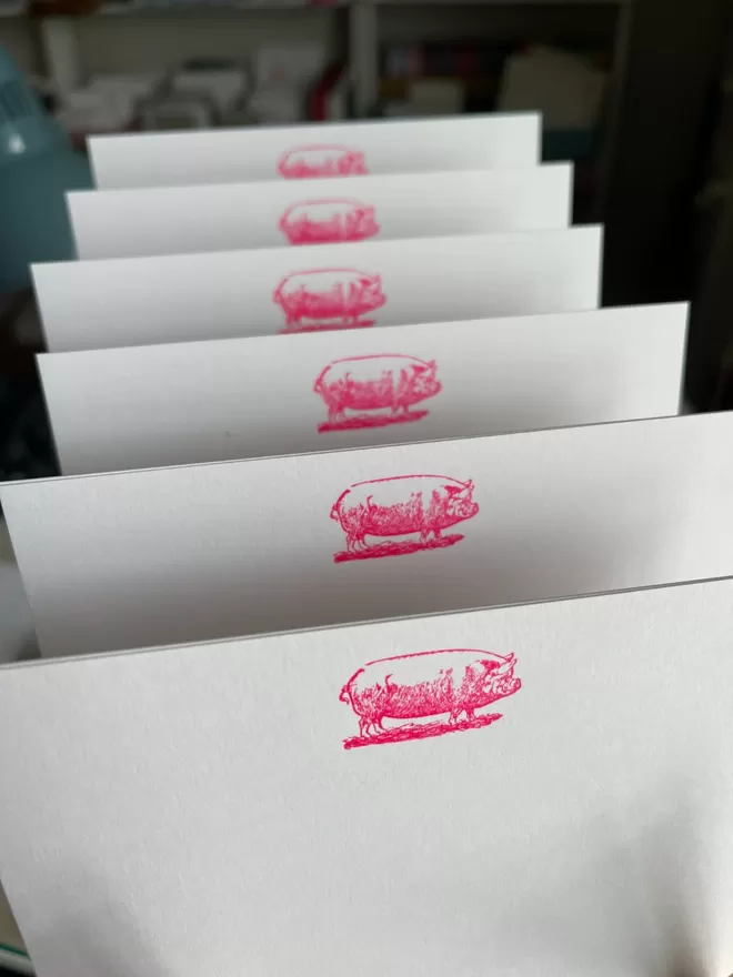 South London Letterpress Pink Pig Notecards seen lined up.
