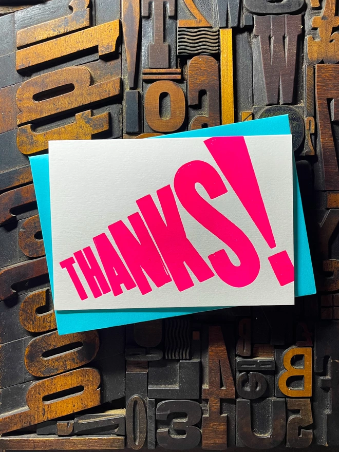 Thanks! A vibrant thank you typographic letterpress card with deep impression print using fluorescent pink, with a range of colourful envelopes. Slight print variations adding to the style anding to the charm of this handmade greeting card.