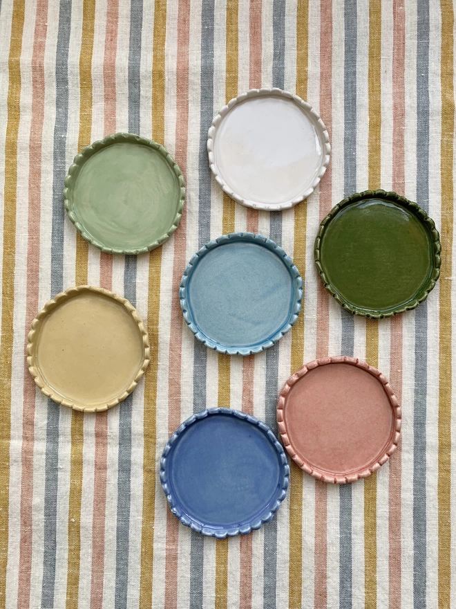 a group of coasters in varied colours
