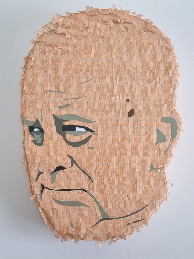 portrait pinata of a bald man looking off to the left