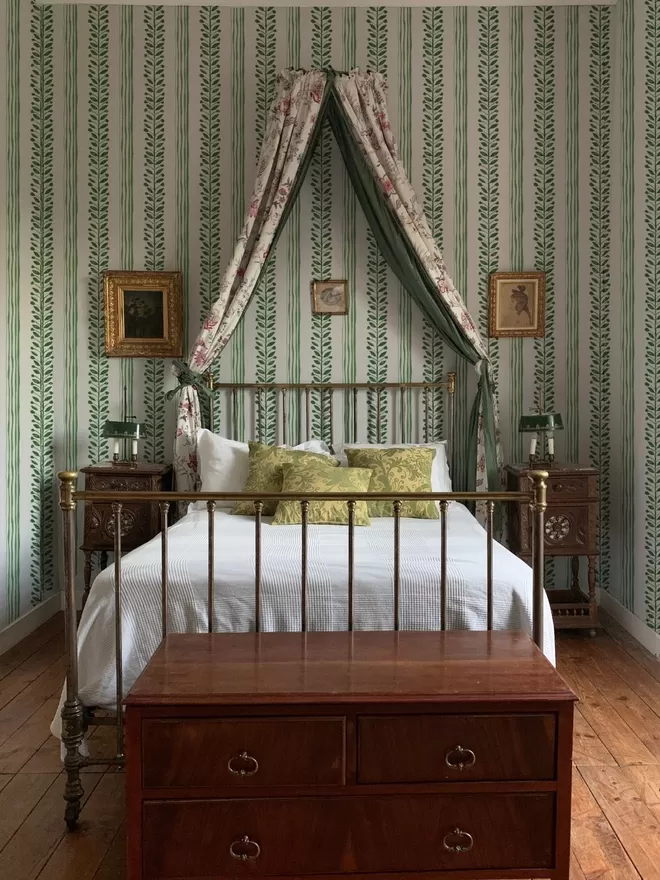 Annika Reed Studio Olive Wallpaper seen in a bedroom with a canopy bed.